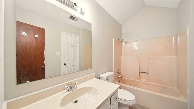 979 Ray Bluff Rd, Millington, TN 38053 - full bath featuring toilet, lofted ceiling, vanity, washtub / shower combination, and a textured ceiling
