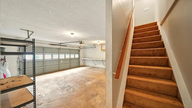 979 Ray Bluff Rd, Millington, TN 38053 - stairway featuring concrete flooring and a textured ceiling