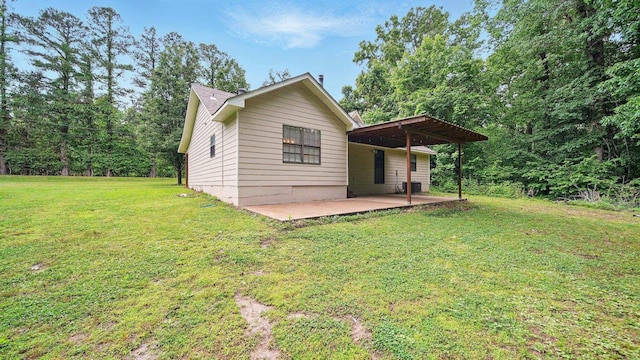 979 Ray Bluff Rd, Millington, TN 38053 - view of home's exterior featuring a patio area, a lawn, and central air condition unit