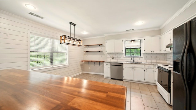 979 Ray Bluff Rd, Millington, TN 38053 - kitchen featuring stainless steel dishwasher, electric stove, black fridge, under cabinet range hood, and a sink