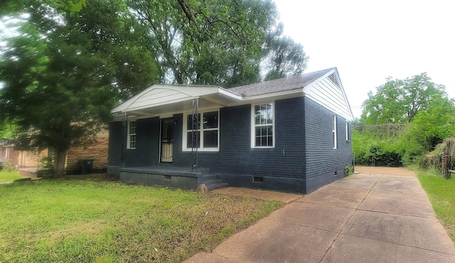 1535 Oberle Rd, Memphis, TN 38127 - view of front of home with crawl space, covered porch, a front yard, and driveway