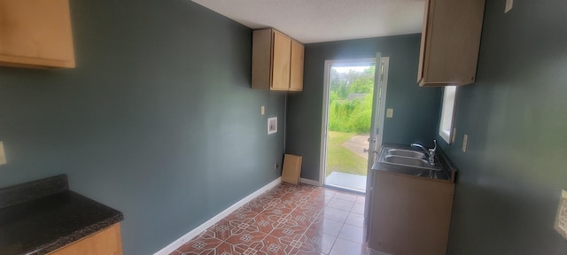 1535 Oberle Rd, Memphis, TN 38127 - doorway featuring a sink, baseboards, tile patterned flooring, and a textured ceiling