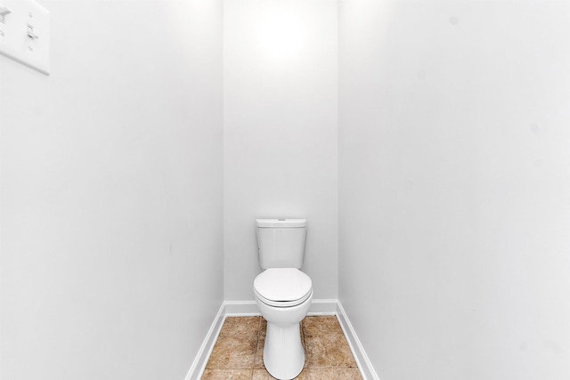 1235 Gimel Ln, Cordova, TN 38016 - bathroom featuring baseboards, toilet, and tile patterned flooring