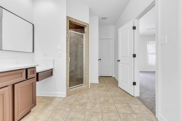1235 Gimel Ln, Cordova, TN 38016 - full bathroom with a stall shower, baseboards, vanity, and tile patterned flooring