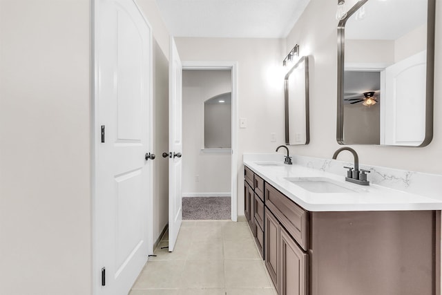 1235 Gimel Ln, Cordova, TN 38016 - full bath featuring double vanity, tile patterned flooring, ceiling fan, and baseboards