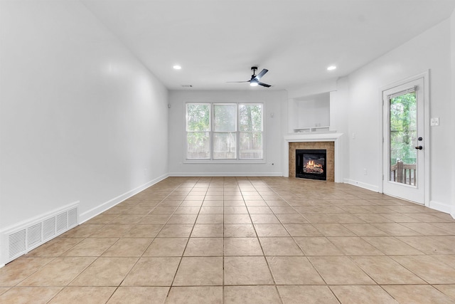 1235 Gimel Ln, Cordova, TN 38016 - unfurnished living room featuring light tile patterned floors, a tiled fireplace, a ceiling fan, recessed lighting, and baseboards