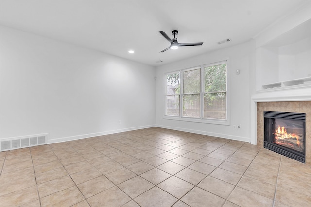 1235 Gimel Ln, Cordova, TN 38016 - unfurnished living room with light tile patterned flooring, a tile fireplace, ceiling fan, baseboards, and recessed lighting