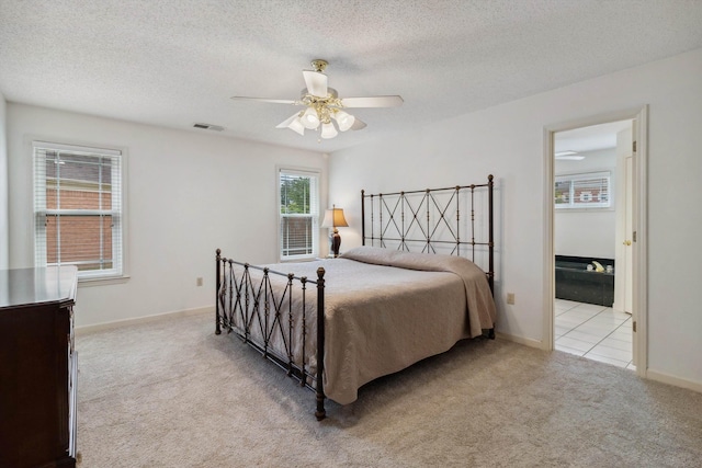 3187 Valley Lake Dr, Bartlett, TN 38135 - bedroom with light colored carpet, a textured ceiling, baseboards, and ceiling fan