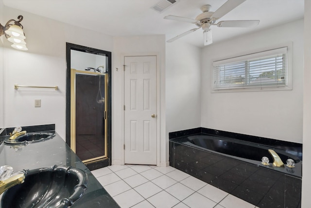 3187 Valley Lake Dr, Bartlett, TN 38135 - bathroom featuring tile patterned flooring, a garden tub, a ceiling fan, and double vanity
