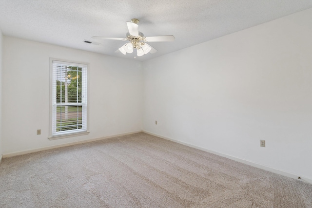 3187 Valley Lake Dr, Bartlett, TN 38135 - carpeted spare room with ceiling fan, baseboards, and a textured ceiling