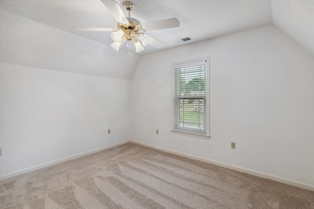 3187 Valley Lake Dr, Bartlett, TN 38135 - additional living space featuring vaulted ceiling, carpet, ceiling fan, baseboards, and a textured ceiling
