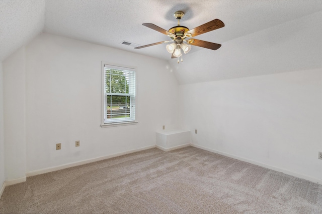 3187 Valley Lake Dr, Bartlett, TN 38135 - additional living space featuring lofted ceiling, carpet floors, a ceiling fan, baseboards, and a textured ceiling