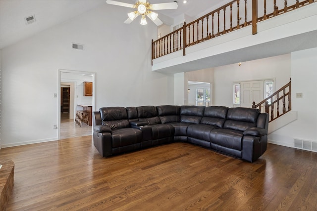 3187 Valley Lake Dr, Bartlett, TN 38135 - living area featuring high vaulted ceiling, a ceiling fan, wood finished floors, stairs, and baseboards