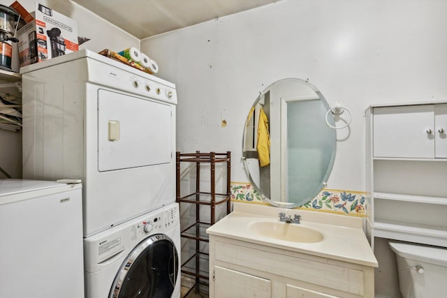 4381 Embassy Dr, Memphis, TN 38108 - laundry room featuring estacked washer and dryer