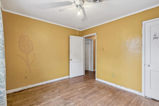 4381 Embassy Dr, Memphis, TN 38108 - unfurnished room with wood finished floors, a ceiling fan, crown molding, and baseboards