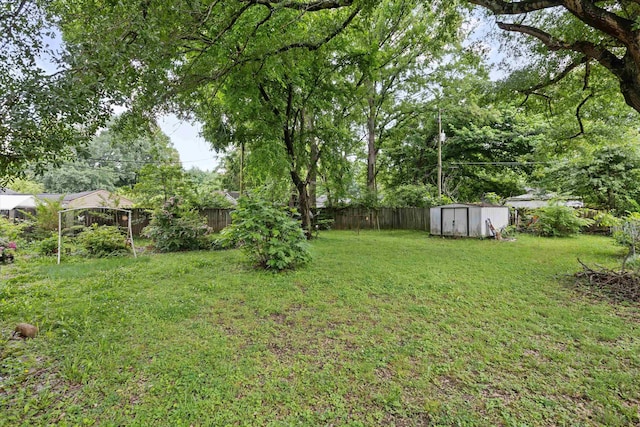 4381 Embassy Dr, Memphis, TN 38108 - view of yard featuring a storage shed and an outdoor structure