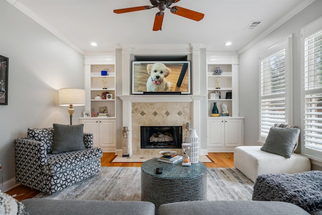 215 Ivy Grove Ln, Collierville, TN 38017 - living room featuring ceiling fan, wood finished floors, plenty of natural light, ornamental molding, and recessed lighting