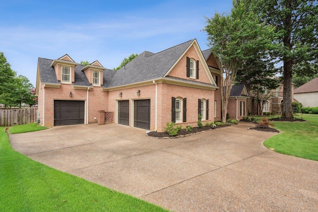 215 Ivy Grove Ln, Collierville, TN 38017 - view of front of property with brick siding, concrete driveway, a shingled roof, and a garage