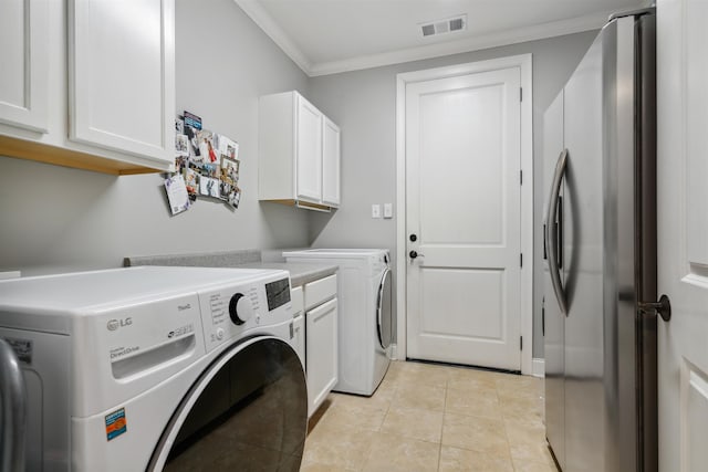 215 Ivy Grove Ln, Collierville, TN 38017 - washroom featuring ornamental molding, washing machine and dryer, cabinet space, and light tile patterned floors