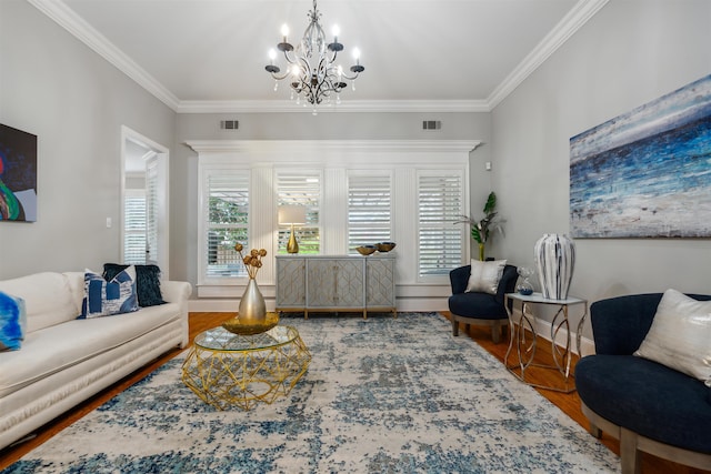 215 Ivy Grove Ln, Collierville, TN 38017 - living room with a chandelier, crown molding, baseboards, and wood finished floors
