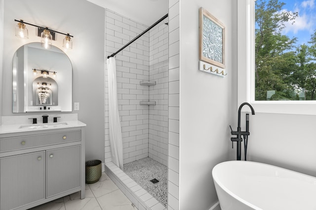 full bathroom featuring a tile shower, marble look tiles, a freestanding bath, and vanity