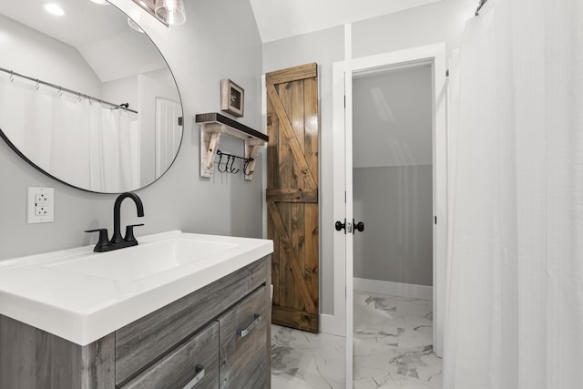 bathroom with marble finish flooring, vanity, recessed lighting, and baseboards