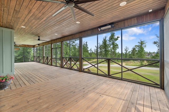 unfurnished sunroom featuring ceiling fan