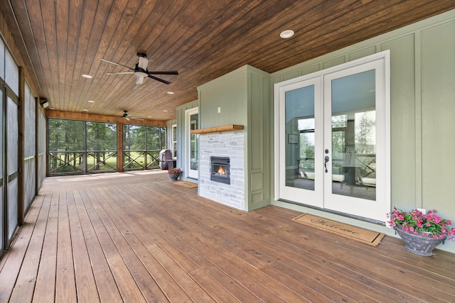 deck with french doors and a ceiling fan
