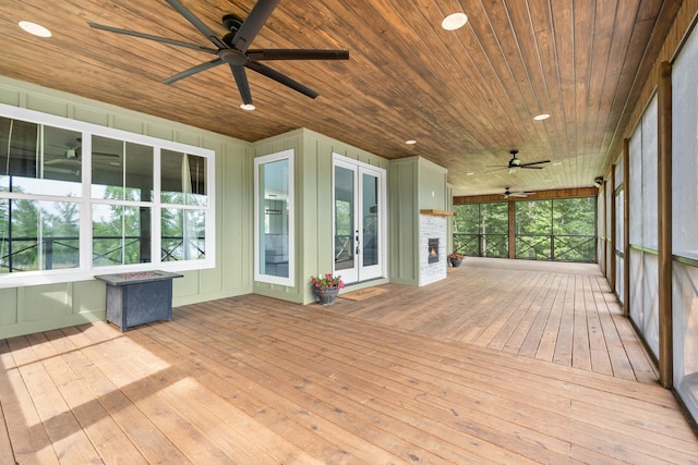 unfurnished sunroom featuring french doors