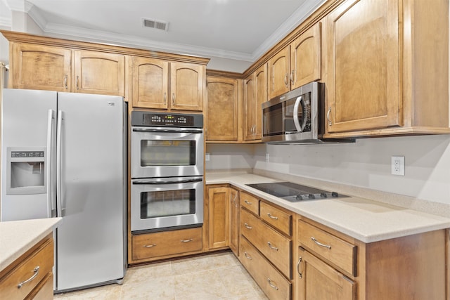 kitchen featuring appliances with stainless steel finishes, ornamental molding, and light countertops