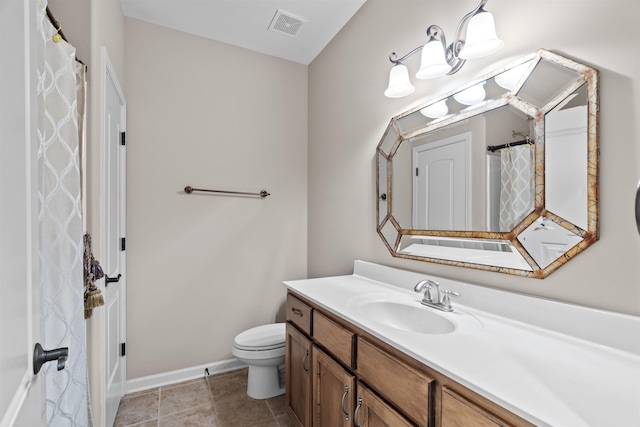 full bathroom featuring vanity, toilet, baseboards, and tile patterned floors