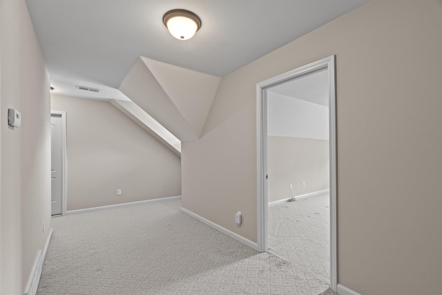 additional living space with carpet flooring and baseboards