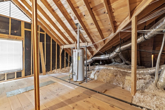 unfinished attic featuring gas water heater