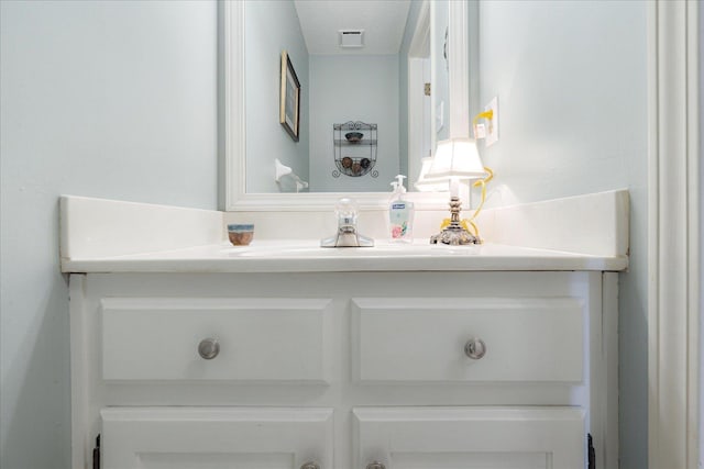 7733 Quick Fox Cv, Memphis, TN 38016 - bathroom featuring vanity and a textured ceiling