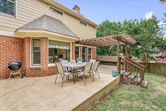 7733 Quick Fox Cv, Memphis, TN 38016 - view of patio with a pergola, fence, outdoor dining area, a wooden deck, and a grill