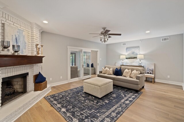 787 Pearson Oaks Dr, Collierville, TN 38017 - living room featuring a ceiling fan, a fireplace, wood finished floors, baseboards, and recessed lighting