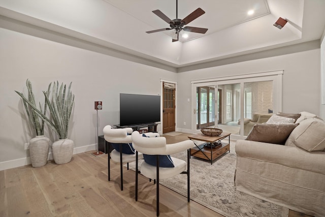 787 Pearson Oaks Dr, Collierville, TN 38017 - living area with baseboards, light wood-style floors, ceiling fan, and a raised ceiling