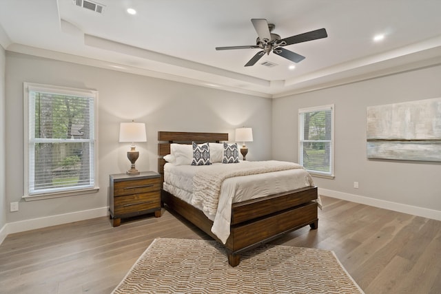 787 Pearson Oaks Dr, Collierville, TN 38017 - bedroom featuring a raised ceiling, light wood-style flooring, baseboards, and recessed lighting