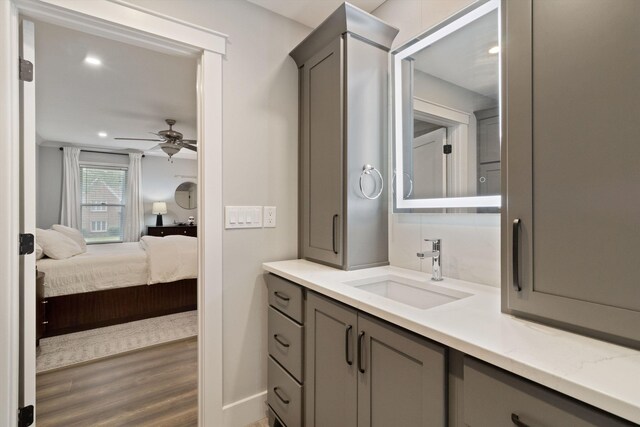 787 Pearson Oaks Dr, Collierville, TN 38017 - bathroom featuring wood finished floors, ceiling fan, vanity, recessed lighting, and baseboards
