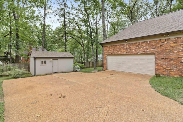 787 Pearson Oaks Dr, Collierville, TN 38017 - garage with fence and concrete driveway