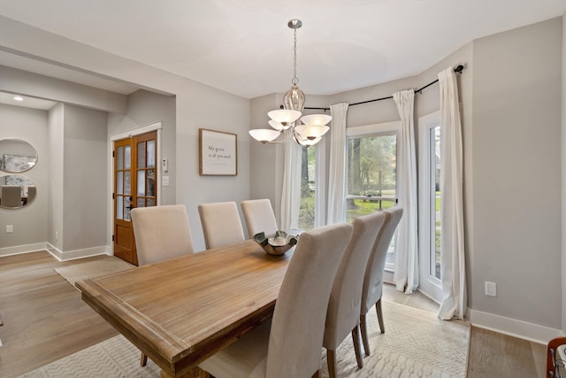 787 Pearson Oaks Dr, Collierville, TN 38017 - dining space featuring a chandelier, baseboards, and light wood-style floors
