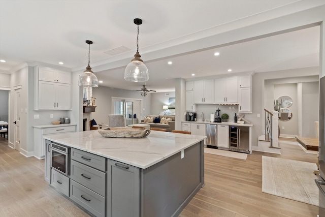 787 Pearson Oaks Dr, Collierville, TN 38017 - kitchen with gray cabinets, white cabinets, a center island, open floor plan, and recessed lighting