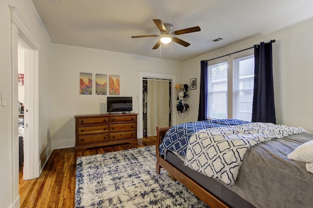 1975 Walker Ave, Memphis, TN 38104 - bedroom with a closet, baseboards, wood finished floors, and a ceiling fan