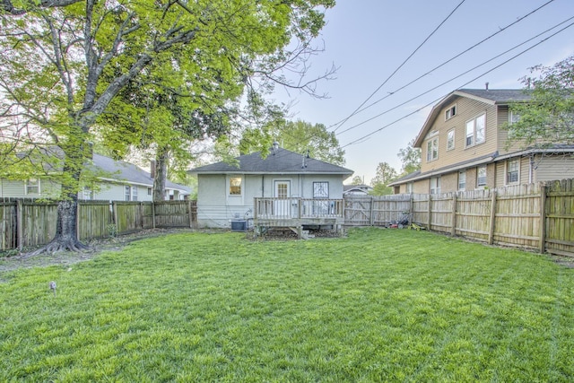 1975 Walker Ave, Memphis, TN 38104 - back of property with a deck, central AC, and a gate