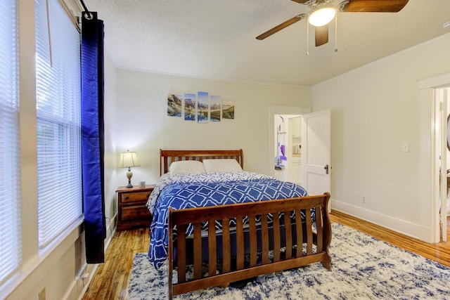 1975 Walker Ave, Memphis, TN 38104 - bedroom with wood finished floors, crown molding, baseboards, and a ceiling fan