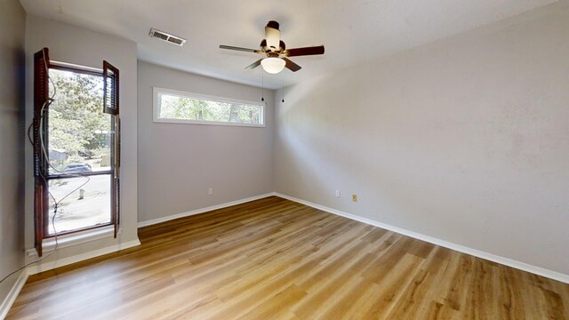 3983 Grahamdale Cir Unit 3983B, Memphis, TN 38122 - empty room with light wood finished floors, baseboards, and ceiling fan