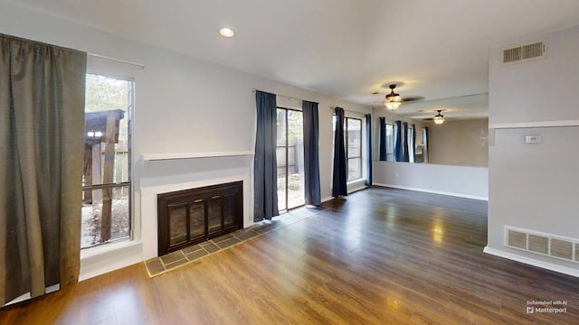 3983 Grahamdale Cir Unit 3983B, Memphis, TN 38122 - unfurnished living room with healthy amount of natural light, a glass covered fireplace, ceiling fan, wood finished floors, and recessed lighting