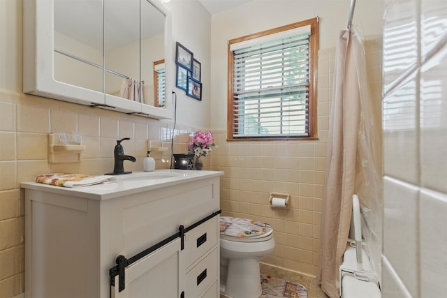 1980 Campbell Rd, Millington, TN 38053 - bathroom with tile walls, toilet, curtained shower, and vanity