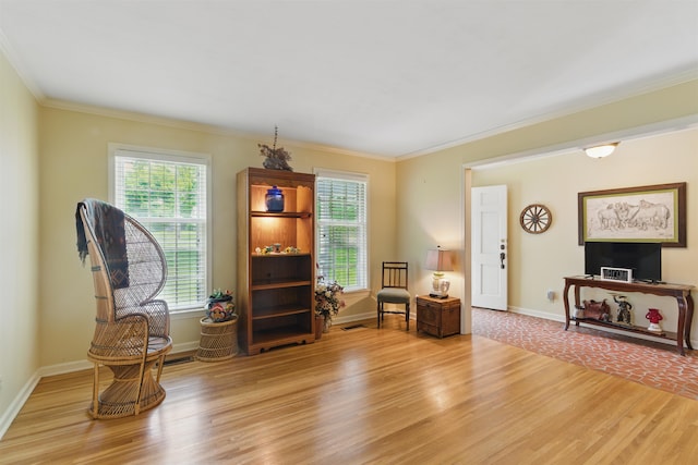 1980 Campbell Rd, Millington, TN 38053 - living area with light wood-type flooring, plenty of natural light, crown molding, and baseboards