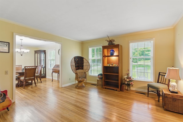 1980 Campbell Rd, Millington, TN 38053 - sitting room with light wood-style flooring, crown molding, a chandelier, and baseboards